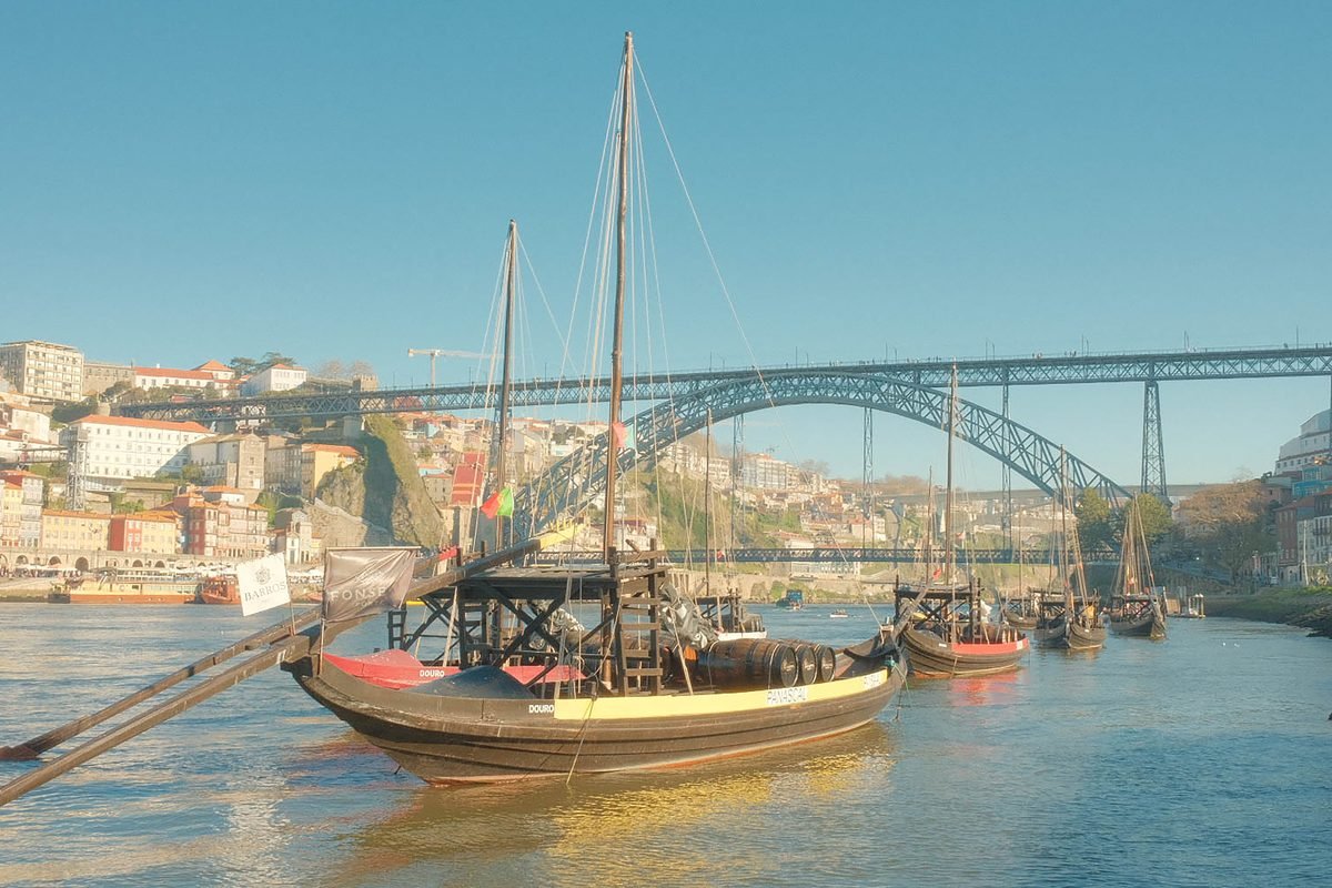 Traditional rabelo boats anchored on Douro River in Porto.
