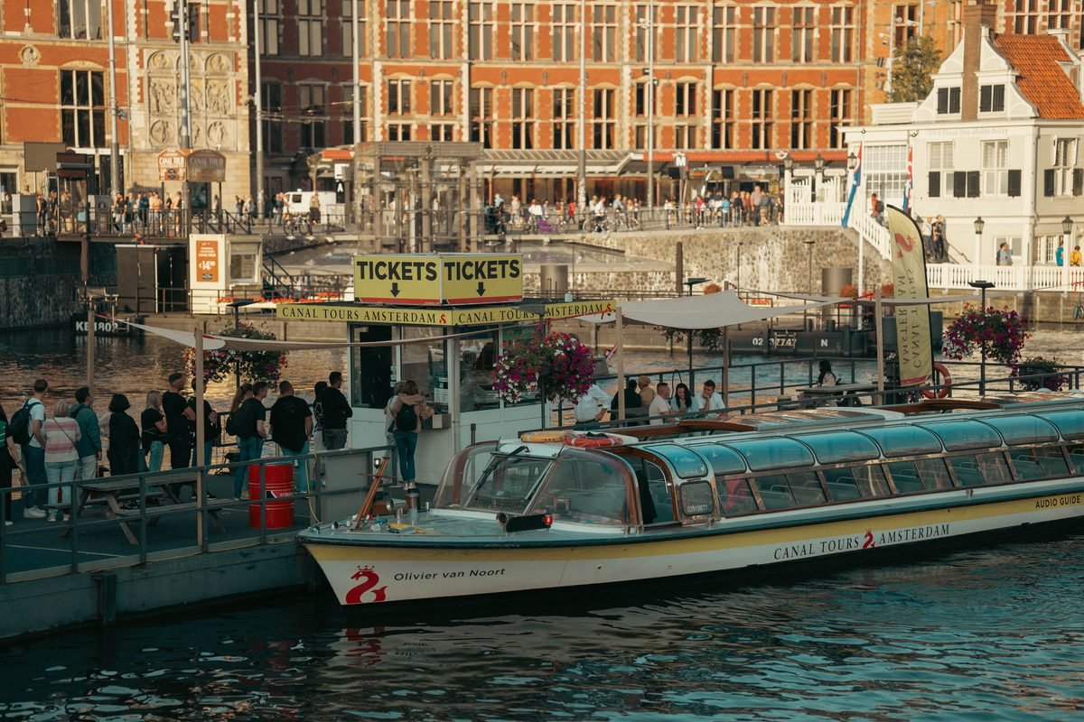 A small tour boat on an Amsterdam canal.