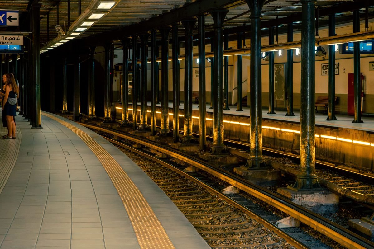 Athens subway station platform illuminated with warm lights