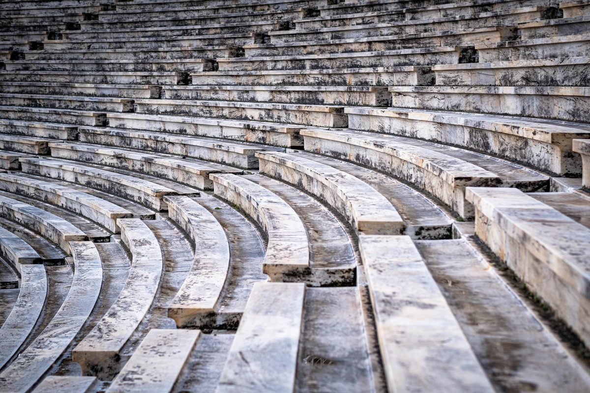 Close-up of weathered marble rows in an ancient stadium