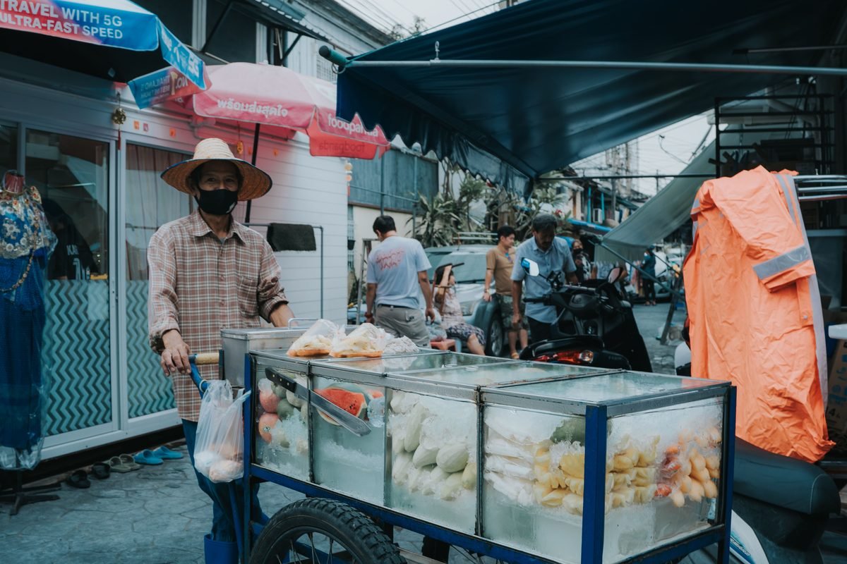 Vendor with a fruit cart on a street