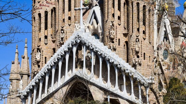Close-up architectural view of the Sagrada Familia facade in Barcelona with ornate details.