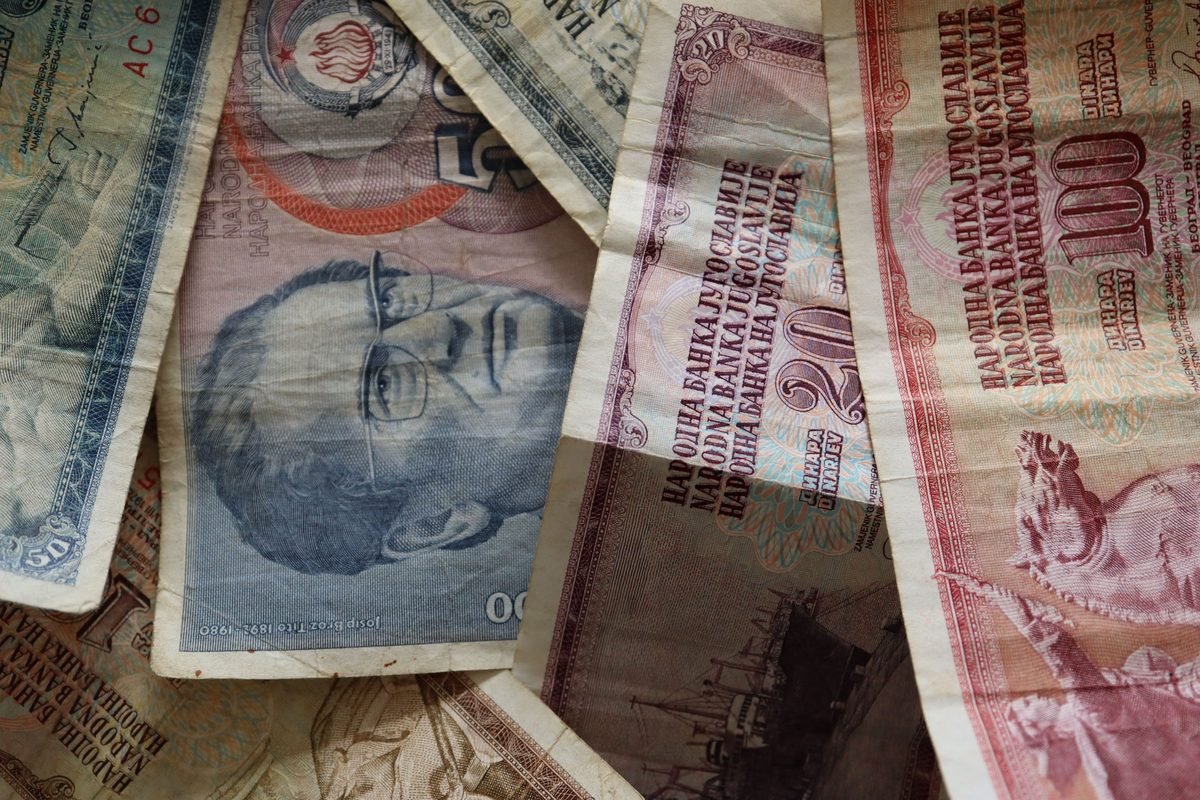 A close-up of diverse vintage banknotes, showcasing historical currency from different countries.