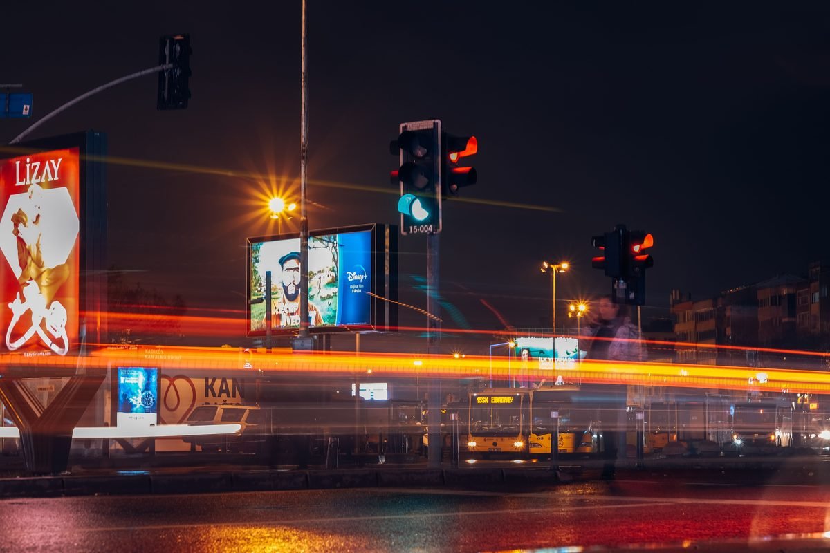 City street at night with traffic light trails