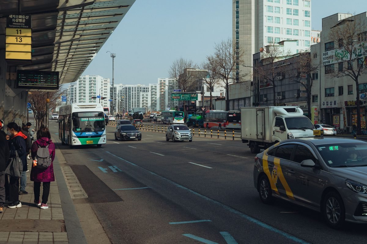 Busy urban street scene featuring city buses and traffic in Korea