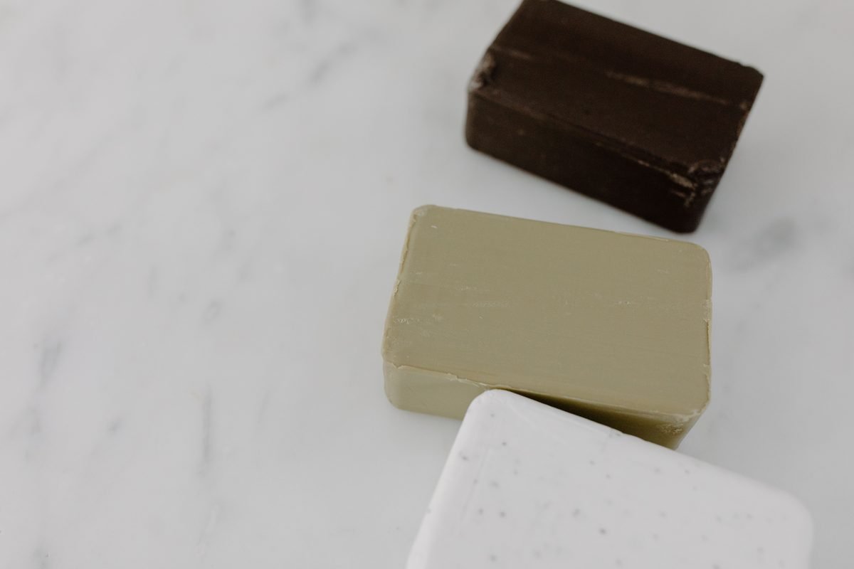 High-angle view of assorted bar soaps on marble surface