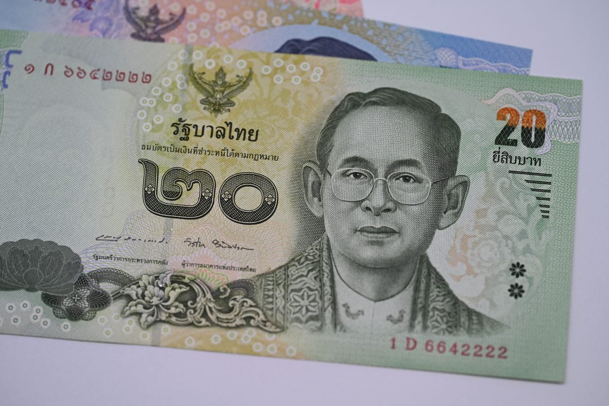 Close-up of Thai Baht banknotes highlighting currency features
