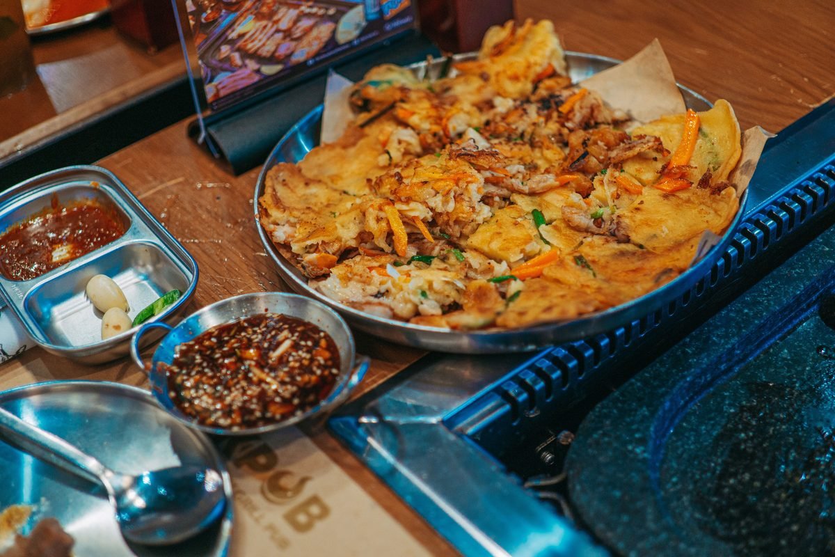 Korean pajeon served with dipping sauces