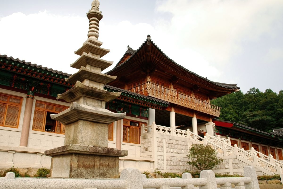 Traditional Korean temple courtyard featuring an ancient stone pagoda