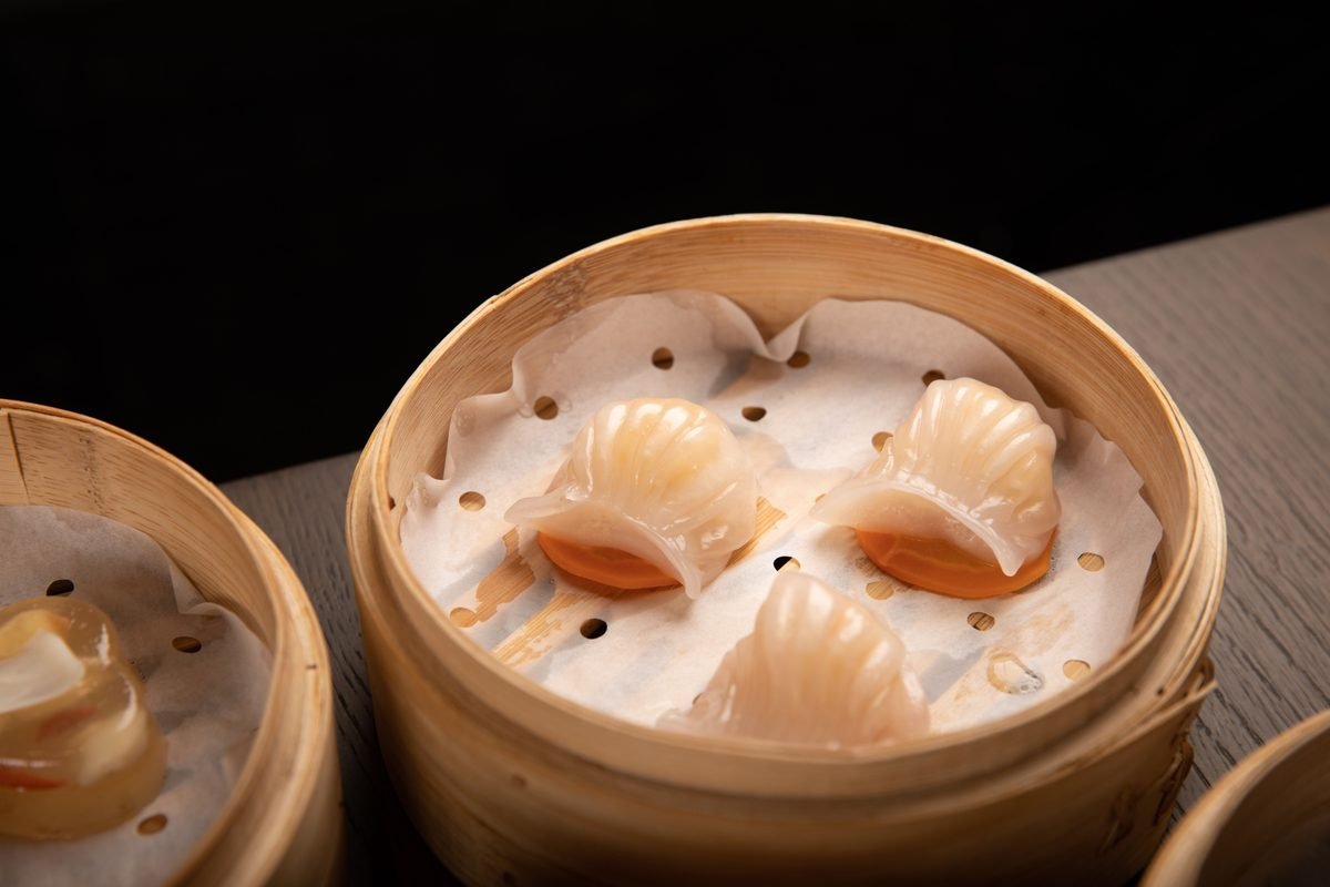 Shrimp dumplings in a bamboo basket.