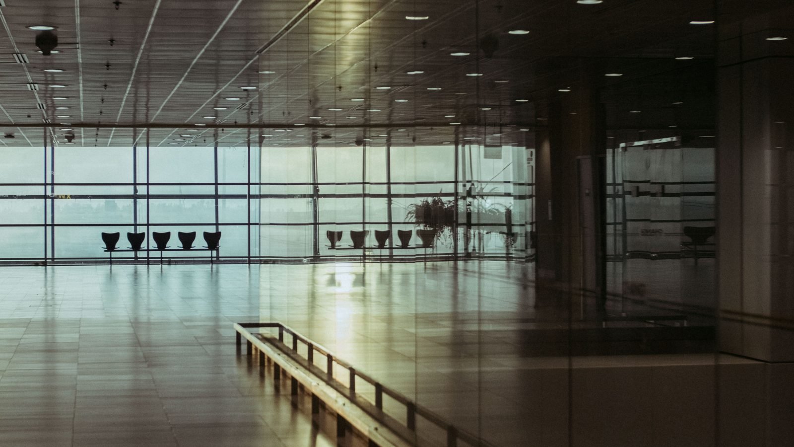 Empty airport terminal in Singapore with glass facade