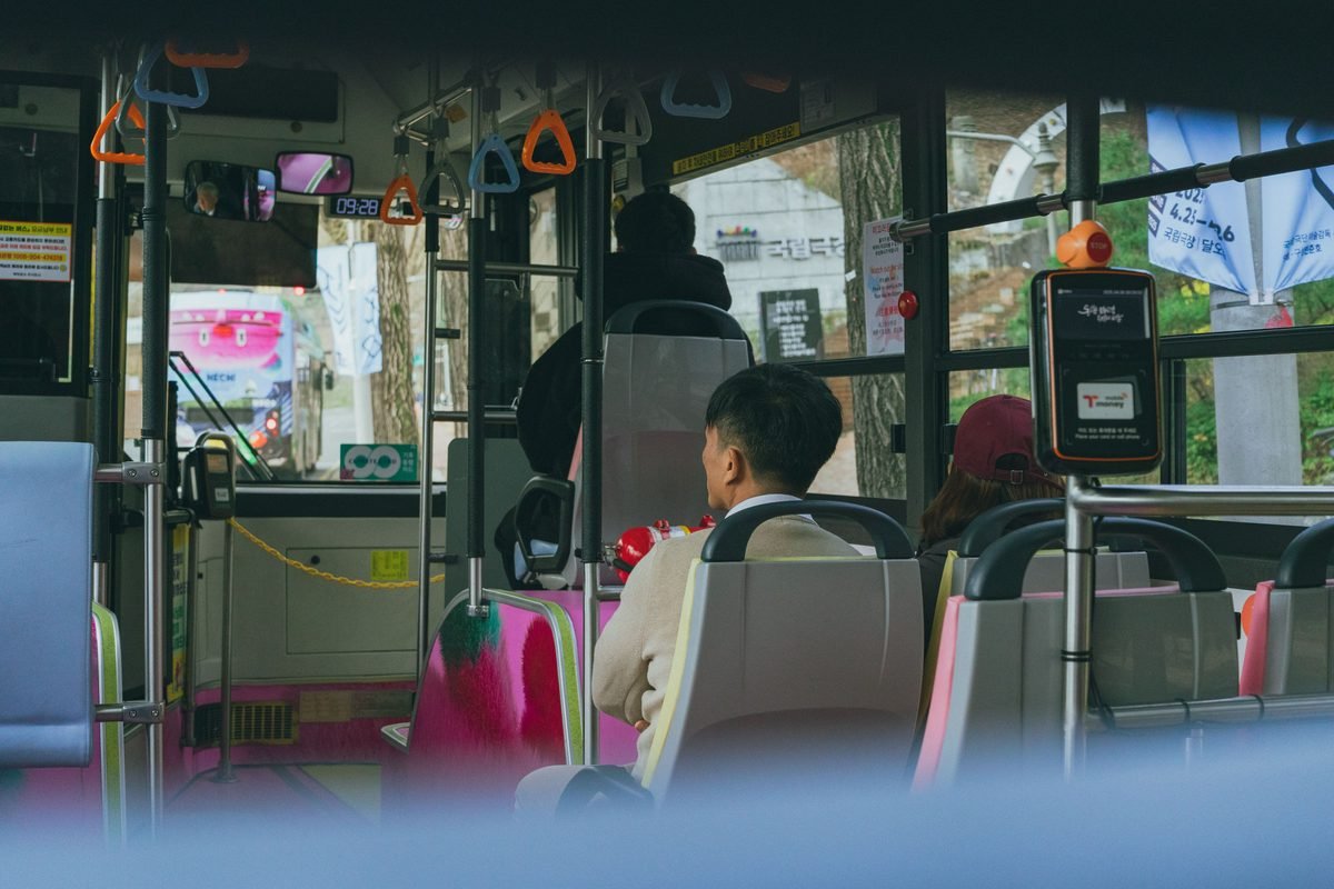 Interior view of a bus in Seoul with Korean transit card reader.