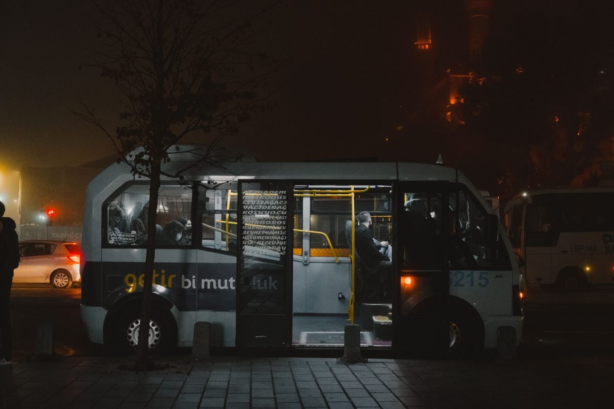 Public bus captured at night on a street in Istanbul.