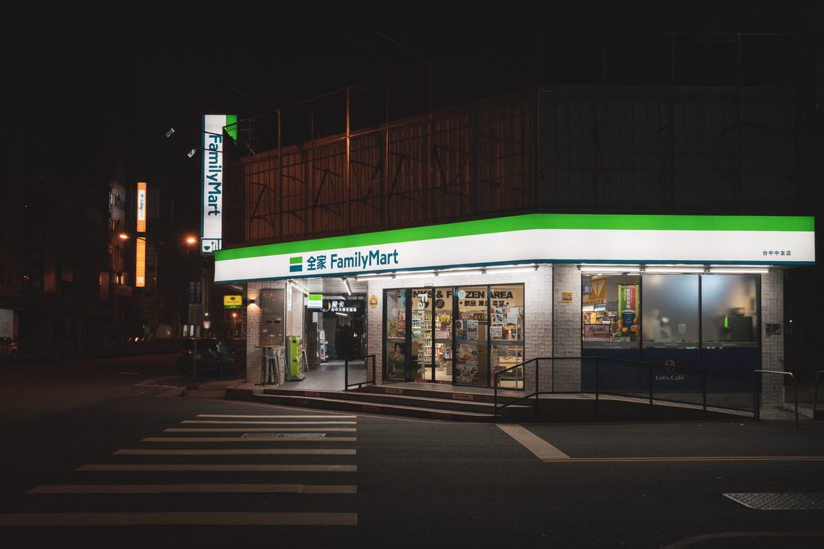Illuminated FamilyMart convenience store facade at night