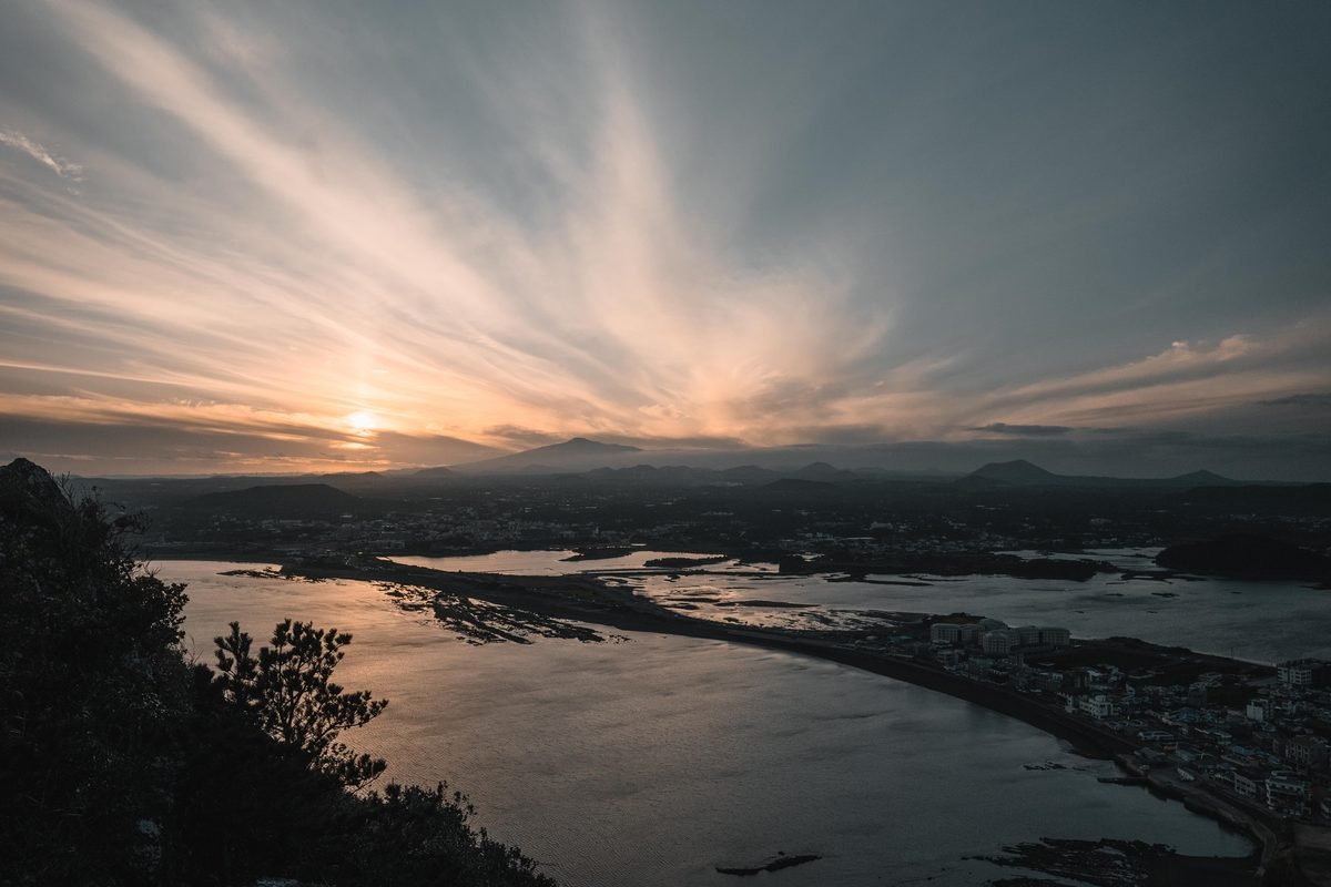 Sunrise view over Seongsan on Jeju Island with striking seascape and clouds