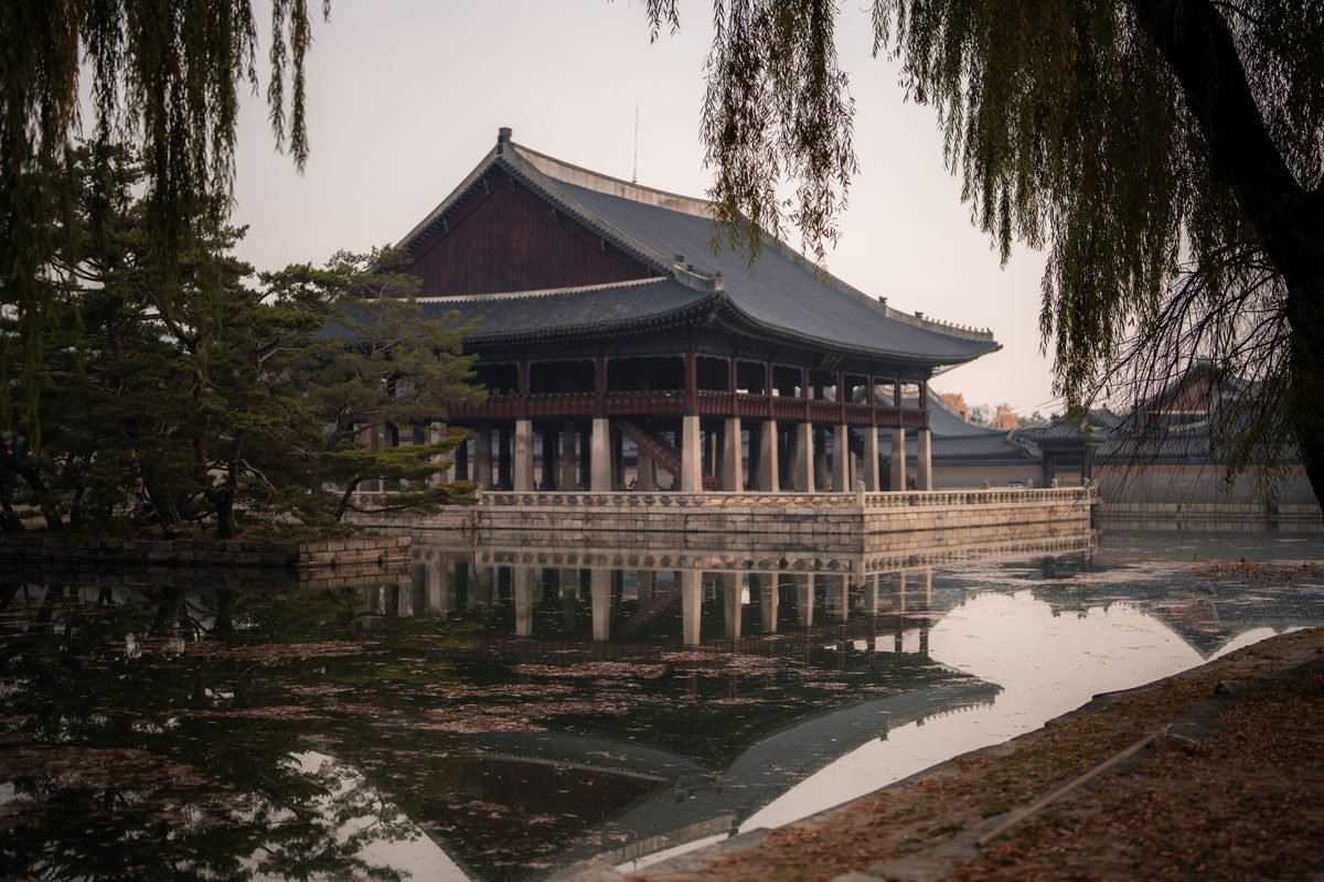 Gyeonghoeru Pavilion reflecting in the pond at Gyeongbokgung Palace, Seoul during autumn