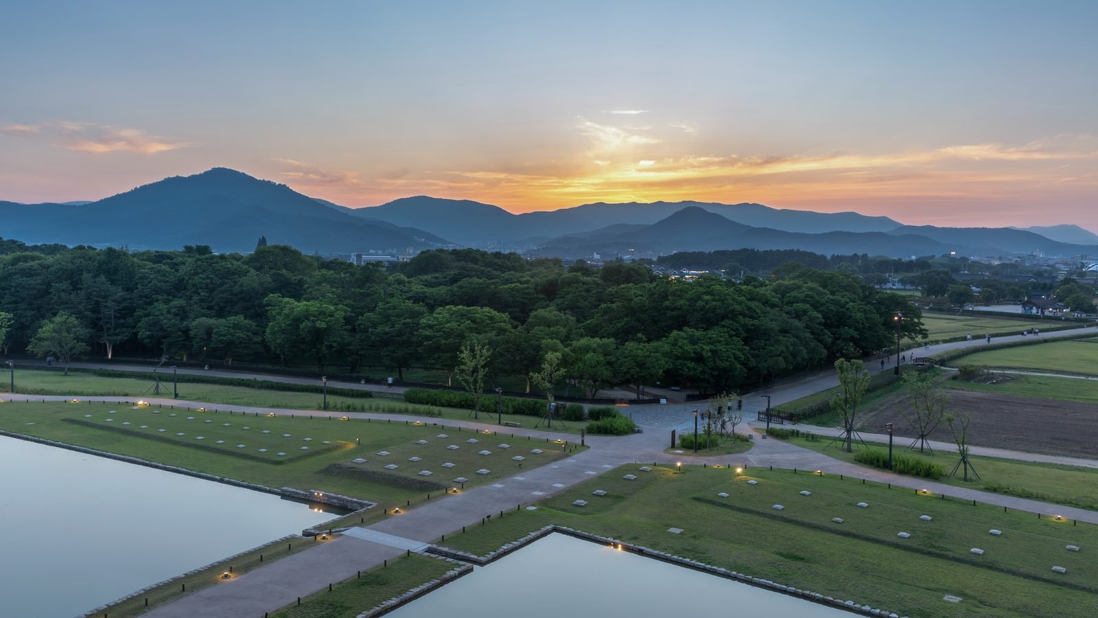 Sunset over Tumuli Park and mountains in Gyeongju, South Korea