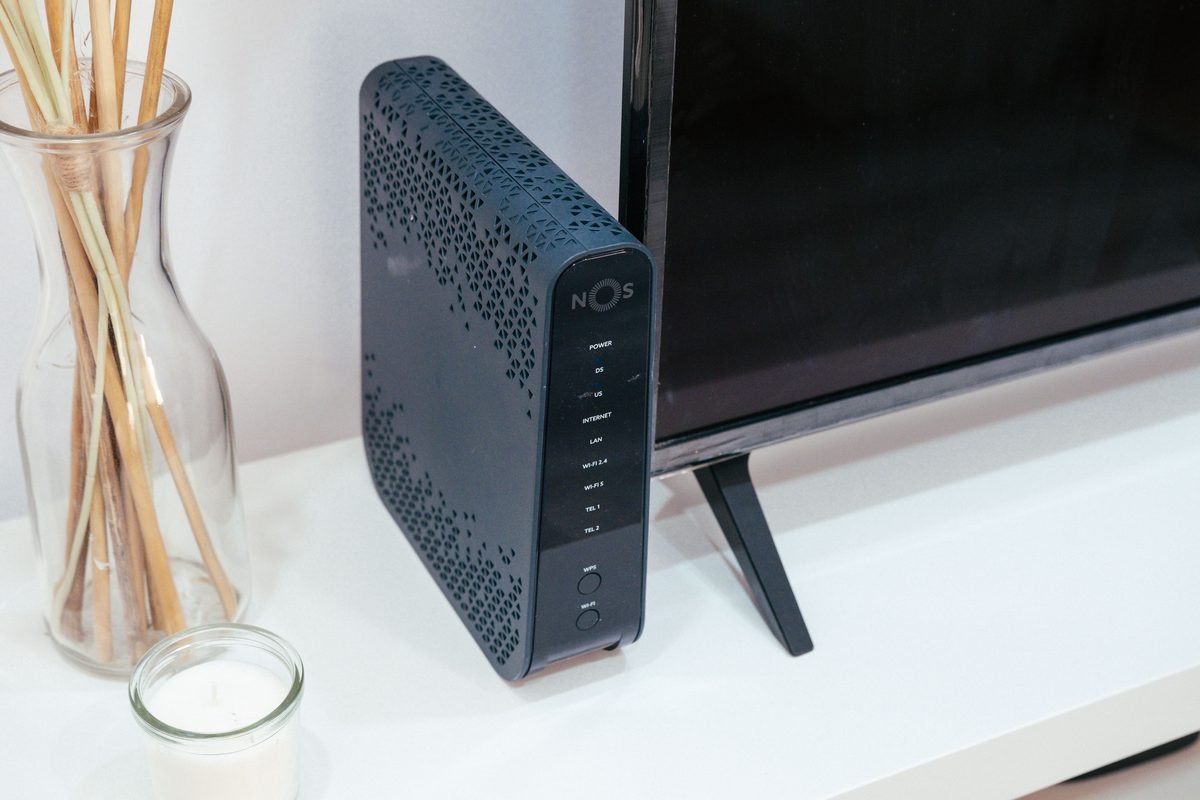 A home technology setup featuring a wireless router and television