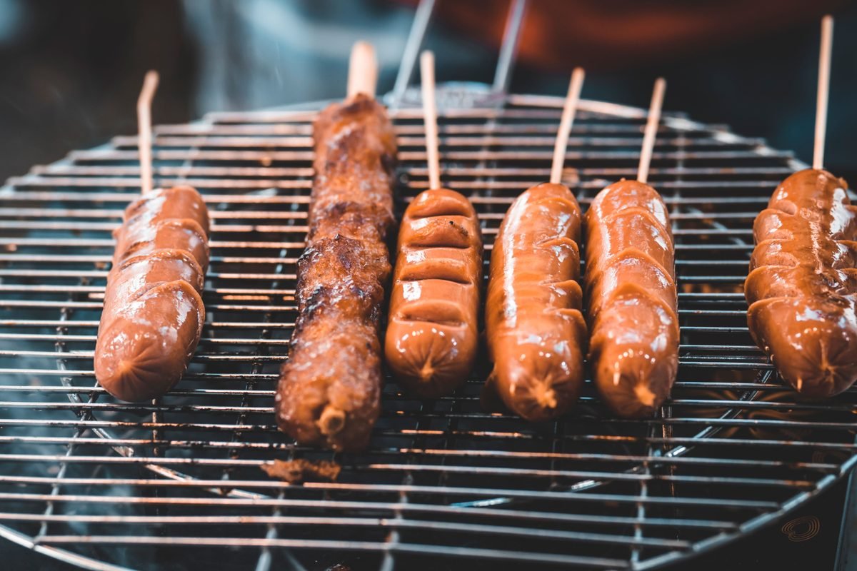Sausage skewers grilling on a barbecue