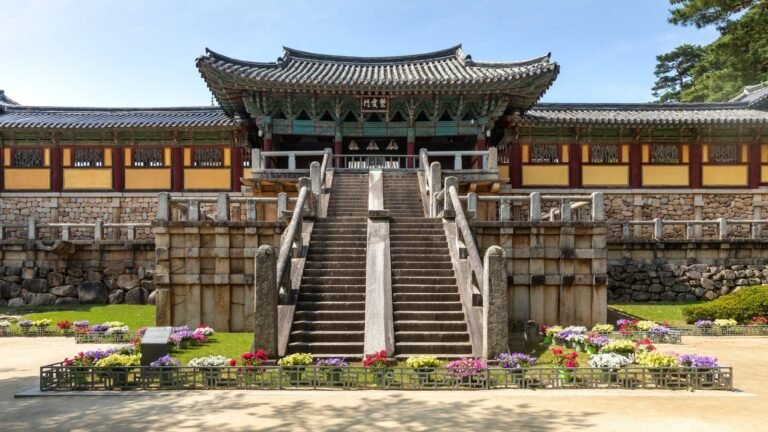 Bulguksa temple entrance gate stairs flower bed and blue sky in Gyeongju South Korea