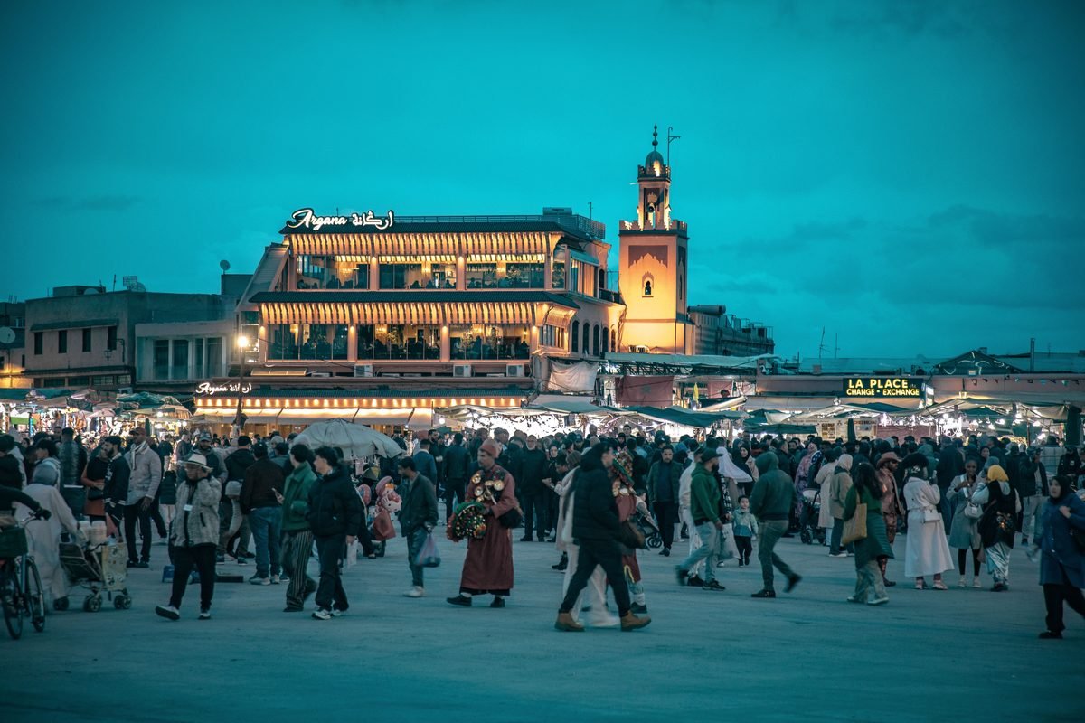 Jemaa el-Fnaa square at dusk with bustling crowds in Marrakesh