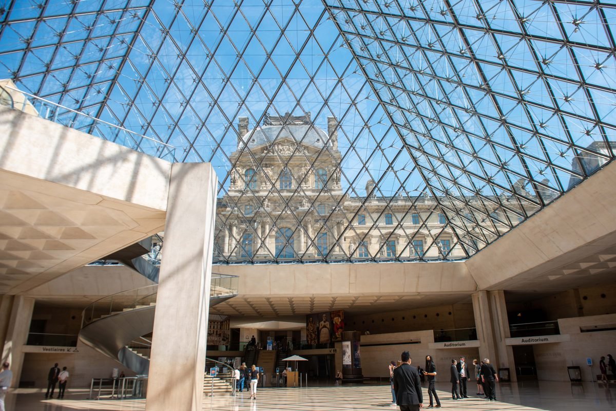 Glass pyramid interior of the Louvre museum showing architectural elegance