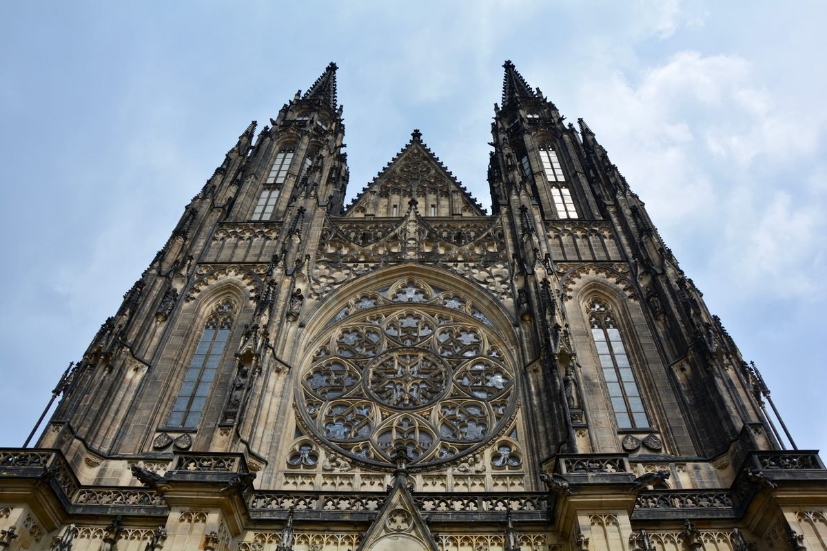 Low angle view of the Gothic facade and twin spires of St. Vitus Cathedral