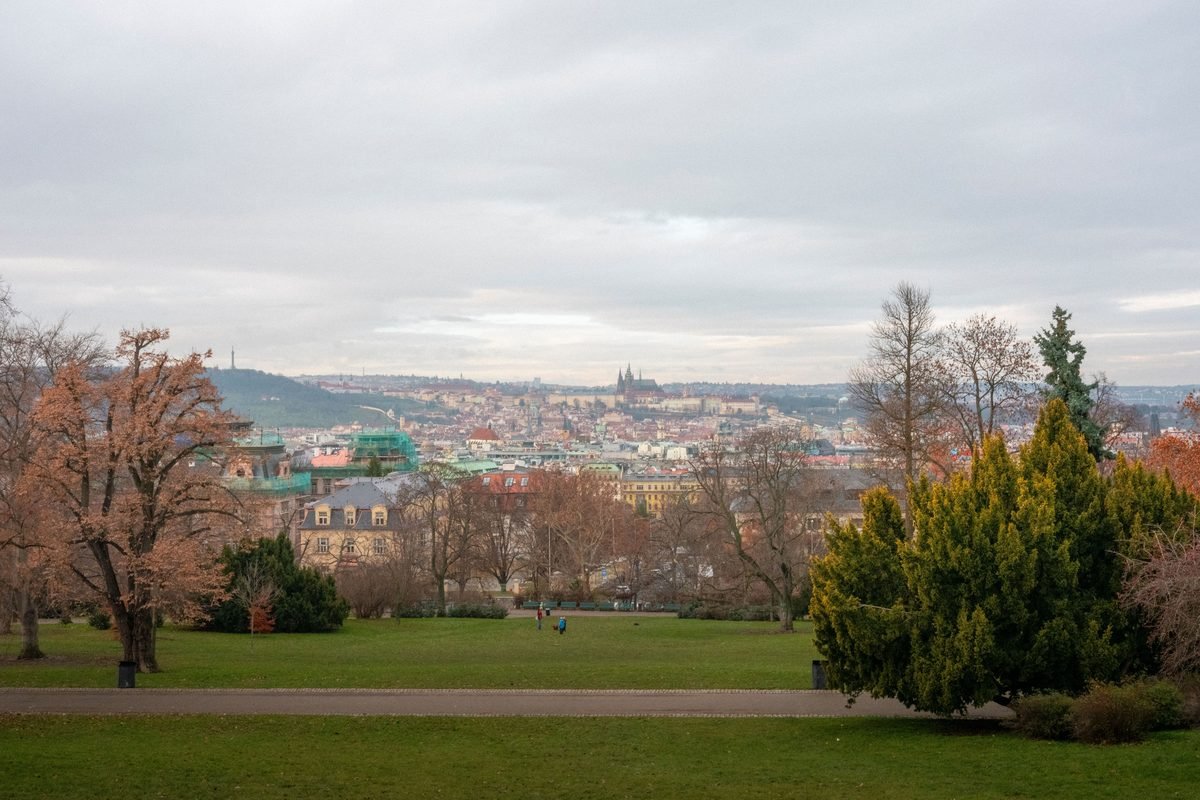 Autumn view of Prague skyline with fall trees from Letná Park