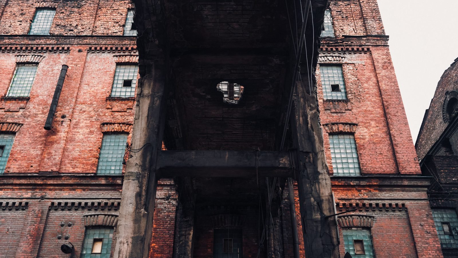 Low angle view of an old brick industrial building architecture.