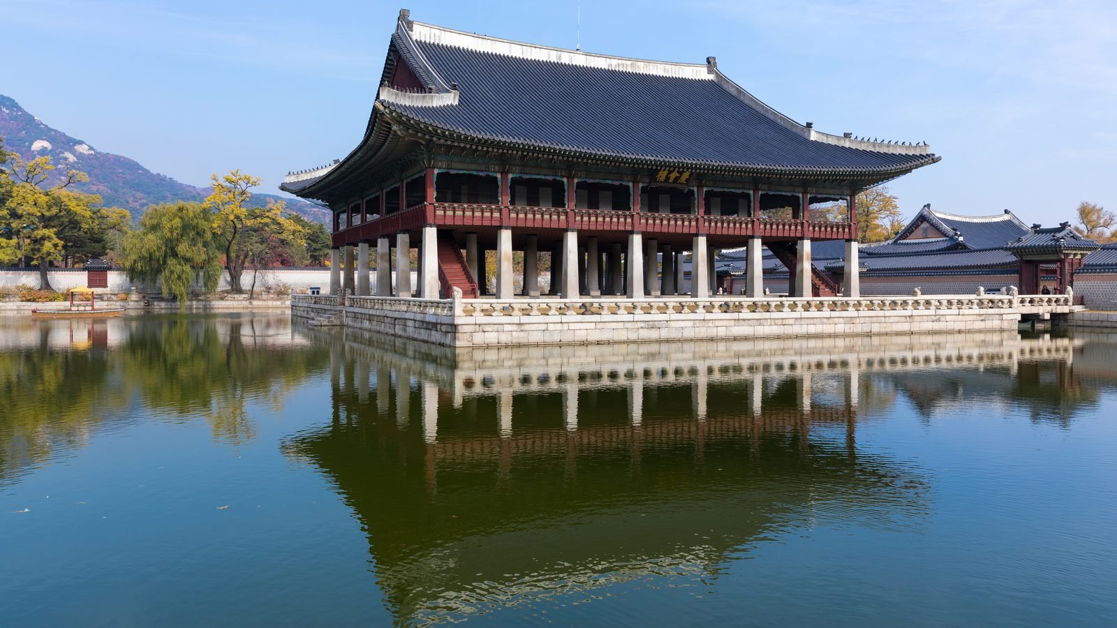 Gyeonghoeru Royal Banquet Hall over a calm pond at Gyeongbokgung Palace in Seoul.