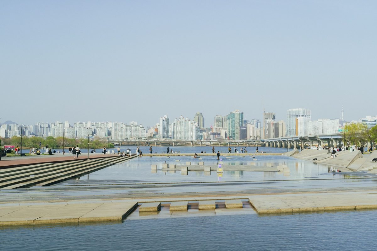 Vibrant spring day overlooking the Seoul skyline from Hangang Park.