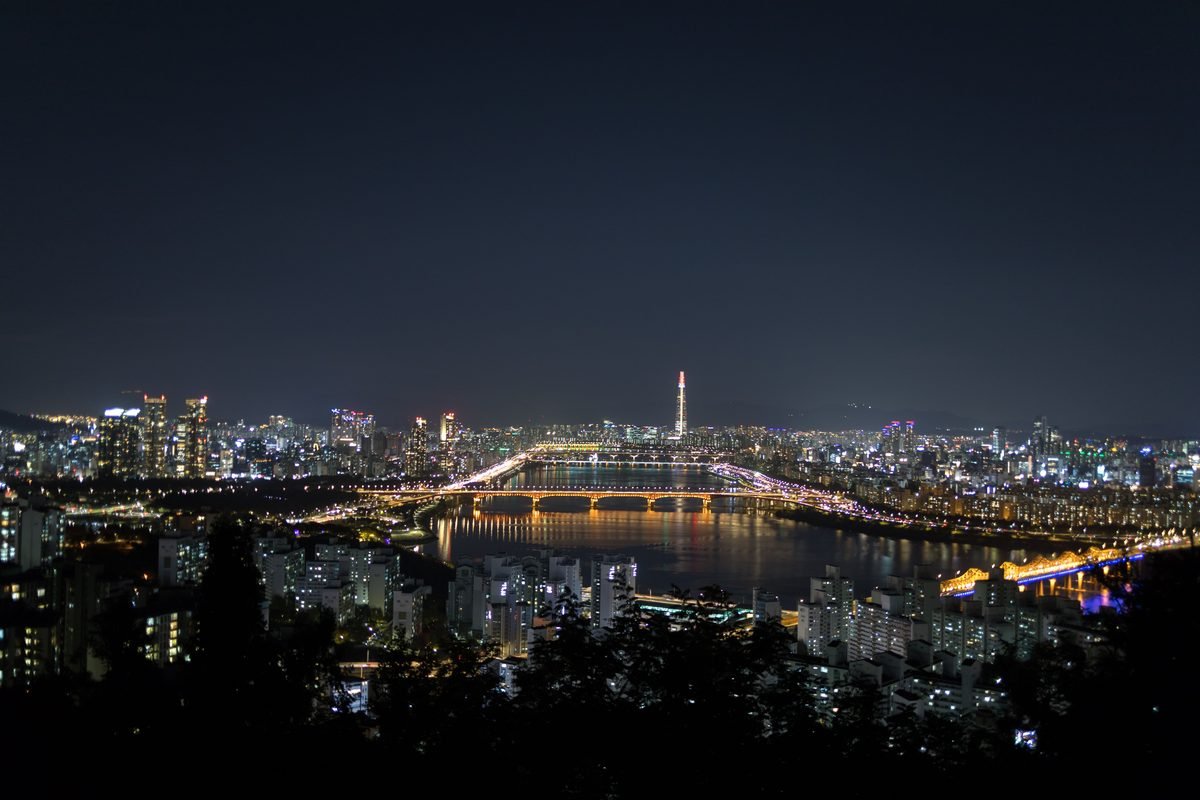 Night cityscape of Seoul illuminated over the Han River.