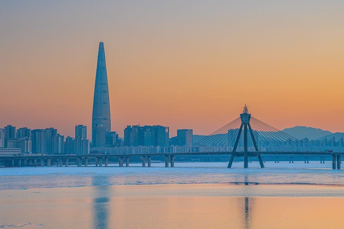 Sunset view of Lotte World Tower and bridge in Seoul.