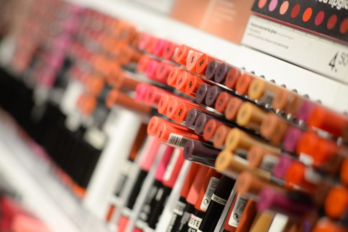 Close-up display of colorful lipsticks and cosmetics.