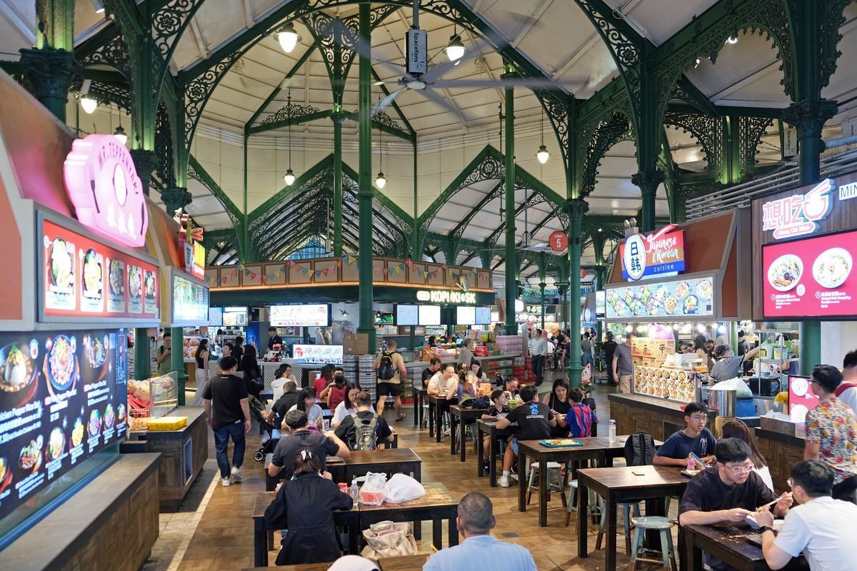 Cast-iron arches and food stalls inside Lau Pa Sat hawker centre, Singapore