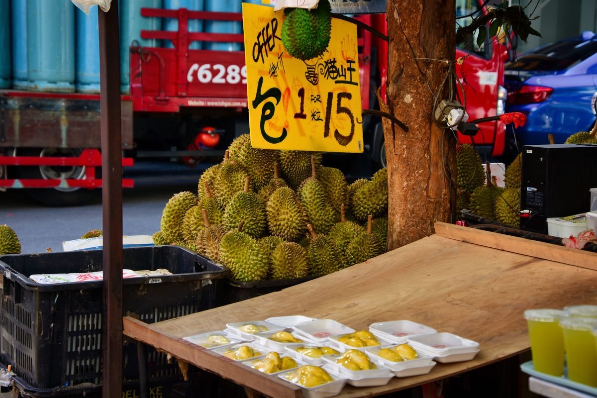 A market stall selling fresh durians on a street in Singapore
