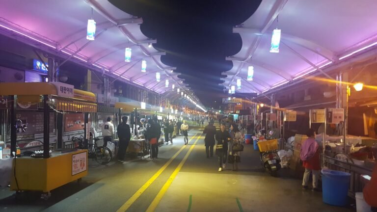Seomun Night Market in Daegu with yellow food stalls and warm lighting
