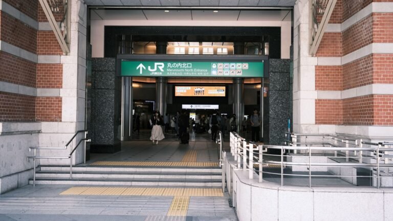 Entrance to Tokyo Station with people and signage visible