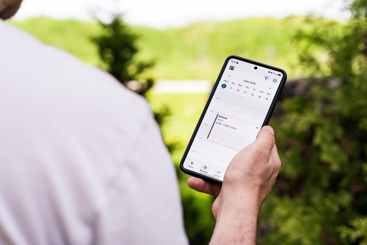 Close-up of a person using a booking application on a smartphone