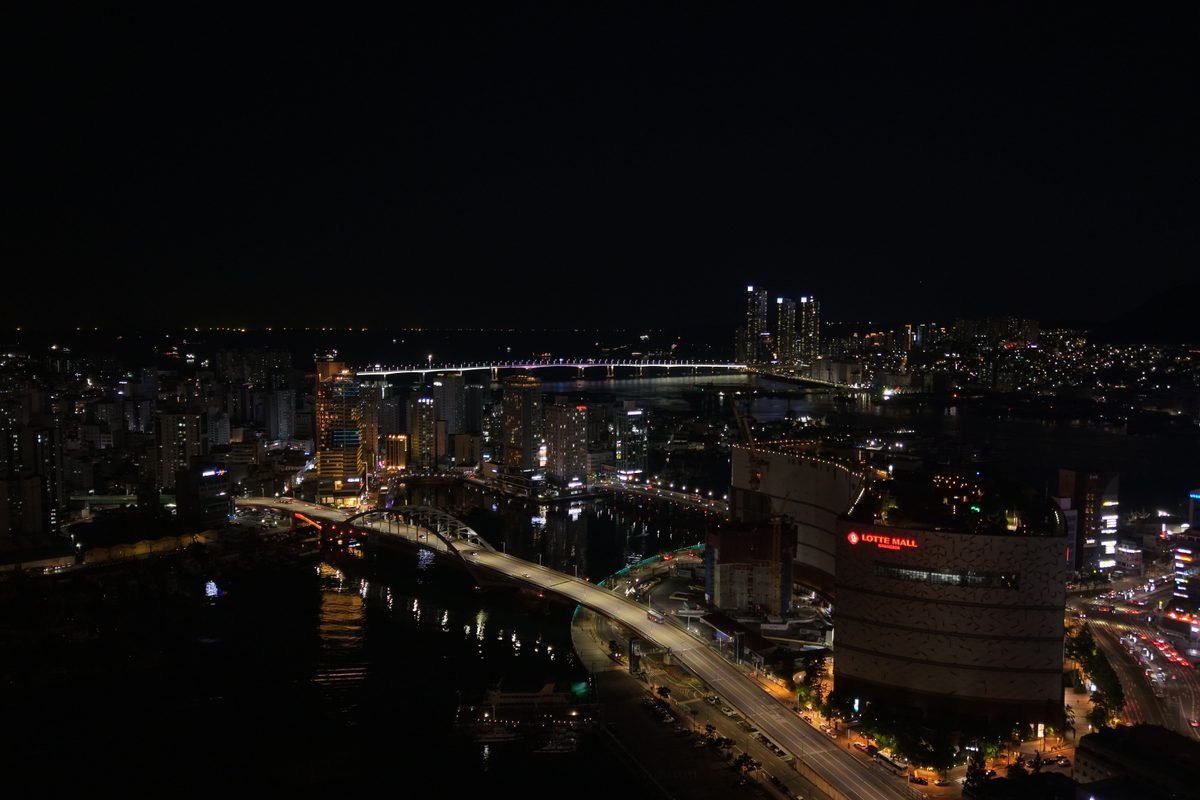 Busan skyline at night with Gwangan Bridge illuminating the cityscape