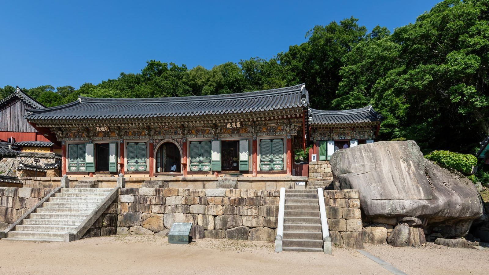 Exterior view of Beomeosa temple with rock stairs and blue sky in Busan South Korea