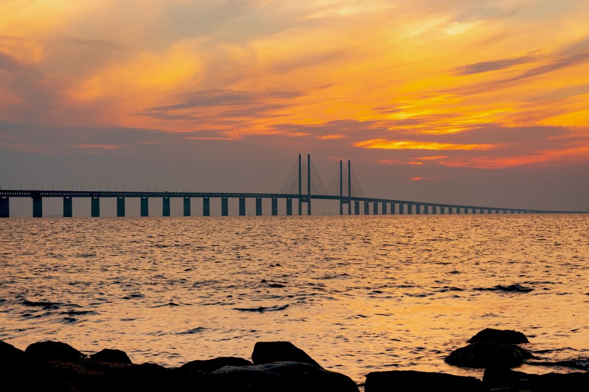 Scenic view of the famous bridge crossing the sea during a golden sunset