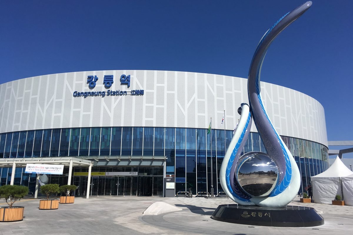 Gangneung Station exterior with modern architecture and a metallic sculpture