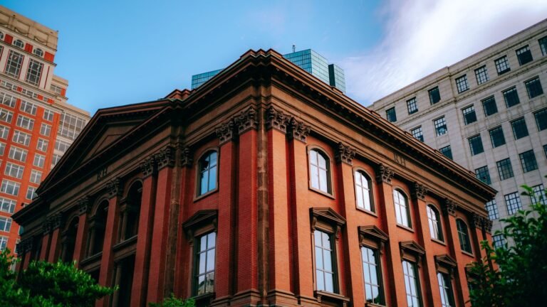 Victorian red brick architectural building facade against a blue sky