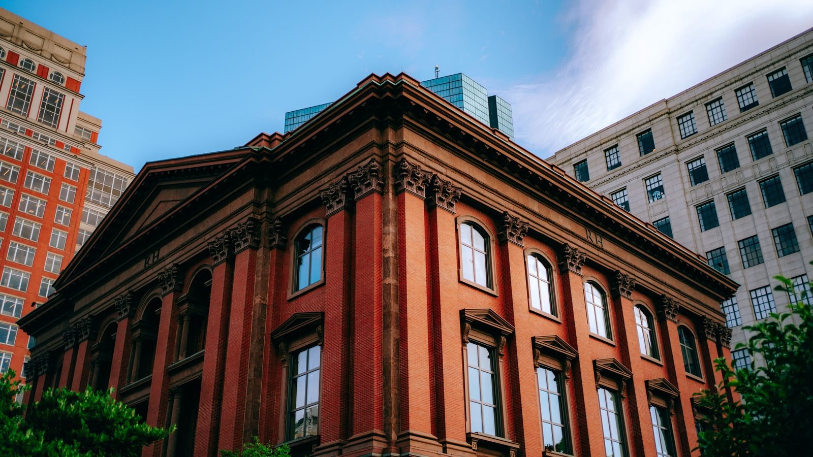 Victorian red brick architectural building facade against a blue sky