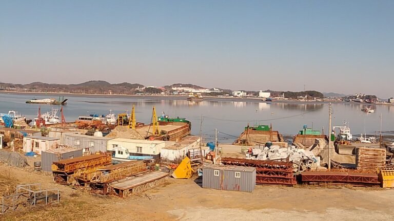Panoramic view of the waterfront and historic brick customs building in Gunsan.