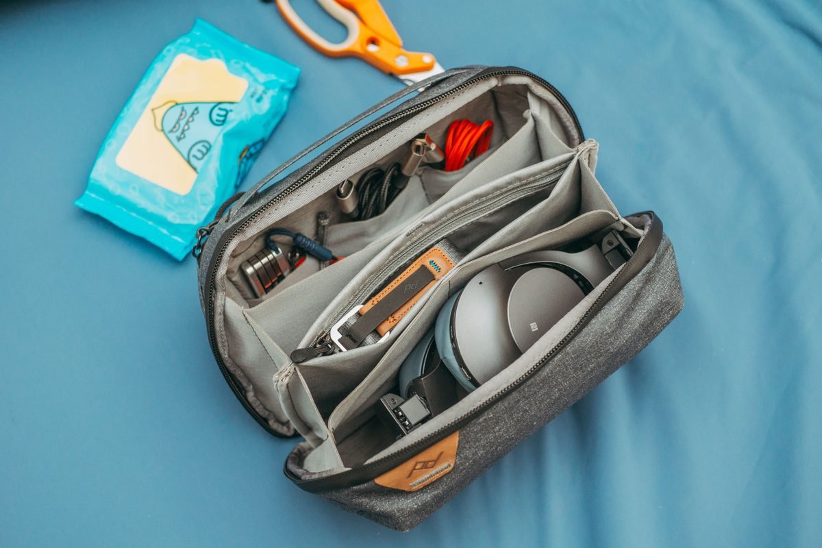 Top view of organized travel tech bag filled with gear.