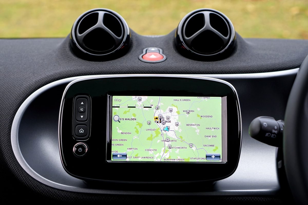 Close-up view of a car dashboard featuring a digital GPS map screen.