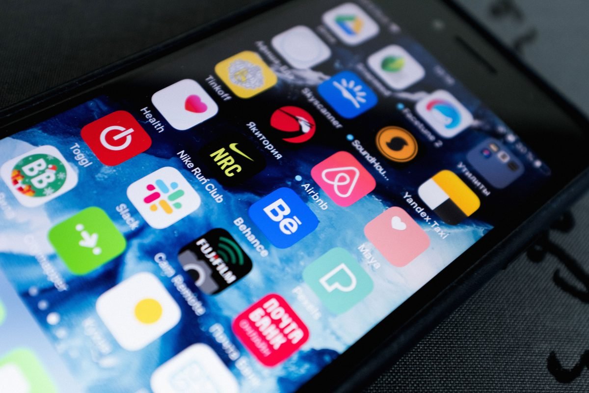 Close-up of a smartphone screen displaying various application icons.