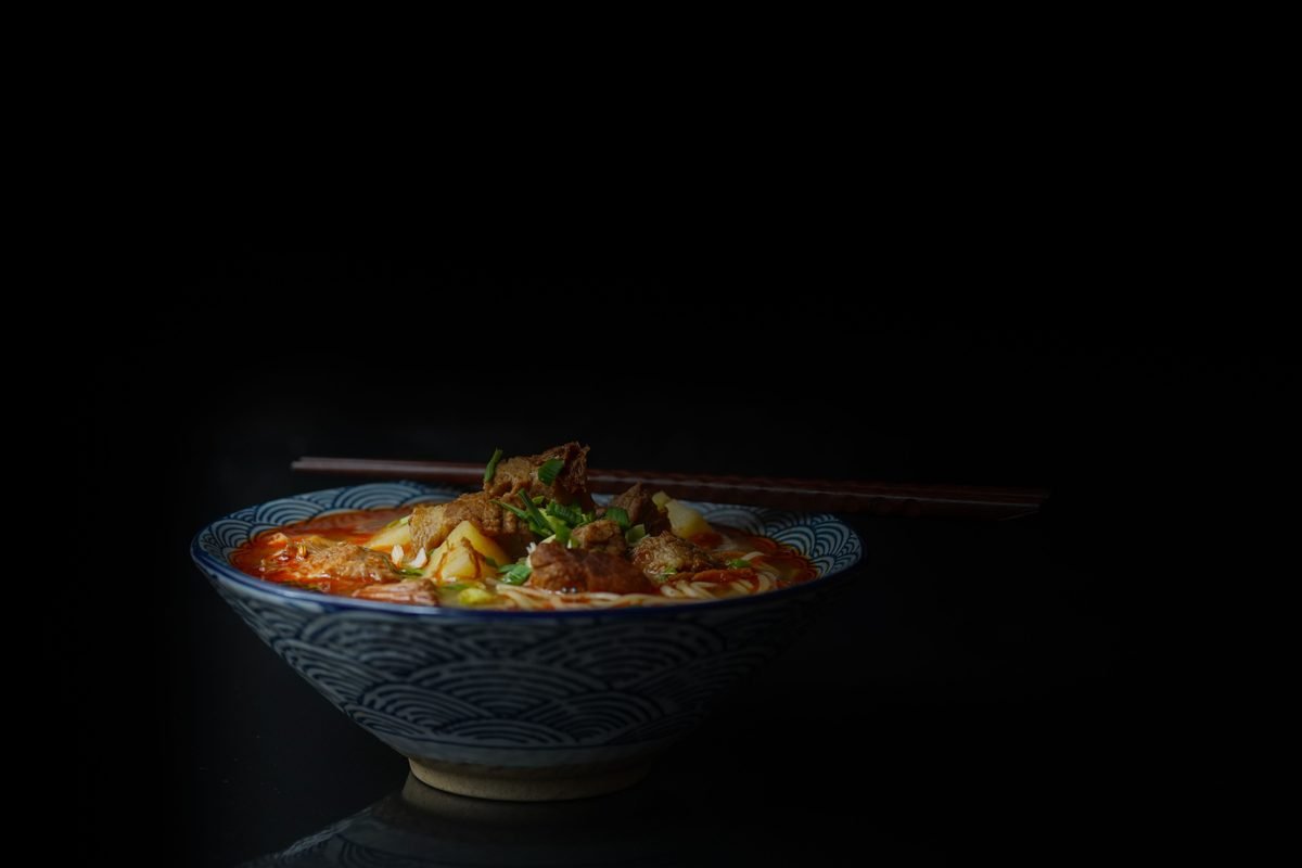 Asian noodle soup in a patterned bowl